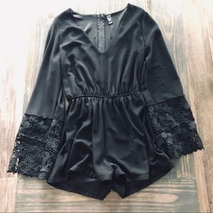 Black romper with lace bell sleeves